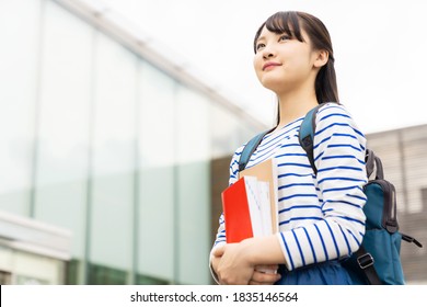 Asian Female Student In School Building.