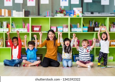 Asian Female Teacher And Kids School Mixed Race In Classroom,Kindergarten Pre School Concept