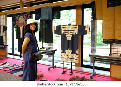 An Asian Female Tourist Looking At A Display Of Old Japanese Traditional Clothings Or Kimono At A Museum In Tokugawa Garden, Nagoya, Japan.