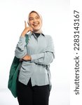 Asian female university student in veil stand with happy face with backpack in isolated background