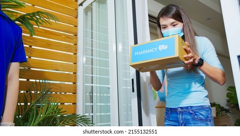 Asian Female Wear Mask Receive Medication Package Box From Pharmacy Hospital Delivery Service At Home