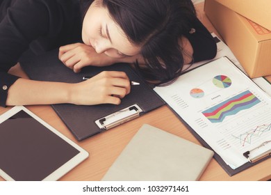 Asian female worker is sleeping on work in office