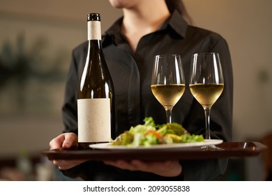 Asian female working in a restaurant - Powered by Shutterstock
