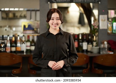 Asian Female Working In A Restaurant