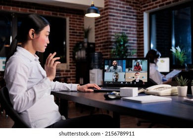 Asian Financial Advisor In Remote Video Conference Call With Executive Board Talking About Business Company Budget Cuts. Agency Employee In Internet Online Meeting With Work Colleagues.