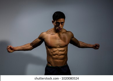 Asian Fitness Model Displays His Biceps Stock Photo 1020080524 ...