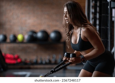 Asian fitness woman exercising with cable tricep machine, workout triceps rope  lifting weights in gym - Shutterstock ID 2367248117