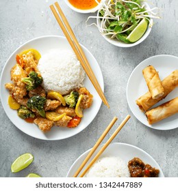 Asian Food Concept With Sweet And Sour Chicken, Tangerine Beef And Egg Rolls