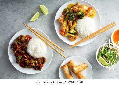 Asian Food Concept With Sweet And Sour Chicken, Tangerine Beef And Egg Rolls