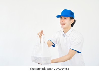 Asian Food Delivery Staff In White Background