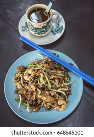 Asian Food - Fried Kway Teow And A Cup Of Coffee
KwayTeow Is A Type Of Noddle In Flatten Shape