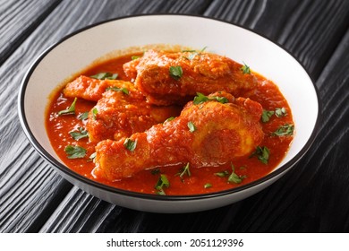 Asian Food Pieces Of Chicken Stew In Tomato Sauce With Spices Close-up In A Bowl On The Table. Horizontal
