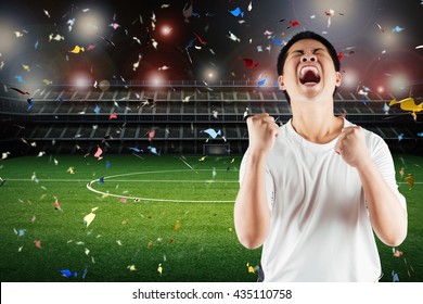 Asian Football Fan Celebrate With Stadium And Confetti Background