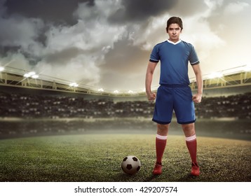 Asian Football Player Standing On Green Grass Stadium