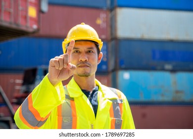 Asian foreman working and checking container box for logistic export and import at logistic shipping cargo containers.