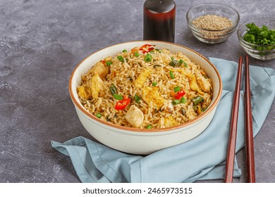 Asian Fried Rice with Chicken and Eggs in a Bowl Low Angle Photo
