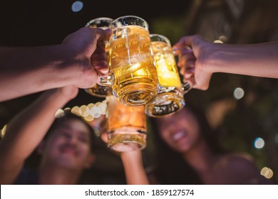 Asian Friends Drinking Beer Outdoors At The Brewery For The New Year Festival Night Time