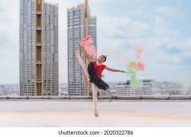 asian girl ballerina dancer performing ballet dance on rooftop of highrise building in city - Powered by Shutterstock