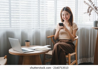 Asian girl. Beautiful woman enjoys talking on the phone in the house by the window. - Powered by Shutterstock - Get 15% off with code: PIKWIZARD15