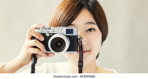 Asian Girl Camera Photographer Focus Shooting Concept - Powered by Shutterstock