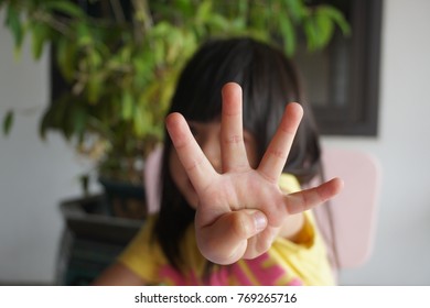 Asian Girl Counting Number Four By Fingers.Education Or Toddler Development Concept. Four Years Old. 