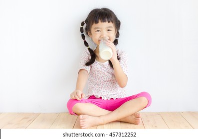 Asian Girl Drinking Milk.