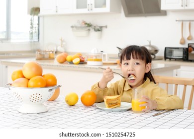 Asian Girl Eating A Big Bread