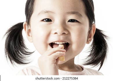 A Asian Girl Eating Snacks.