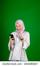 Asian Girl Excitedly When Looking At Mobile Phone Screen