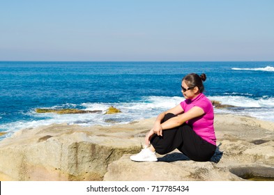 Asian Girl Explores The Coastline Of Bondi Beach In Sydney,Australia.