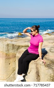 Asian Girl Explores The Coastline Of Bondi Beach In Sydney,Australia.