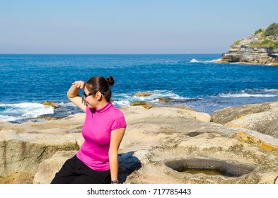 Asian Girl Explores The Coastline Of Bondi Beach In Sydney,Australia.