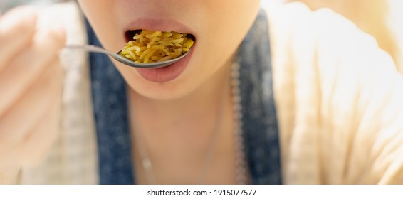 The Asian Girl Hand Holding Spoon And Eating The Egyptian Curry Fried Rice Food At The Restaurant, For Food And Health Concept, Especially Focus.