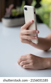 Asian Girl  Hold Mobile Phone For Selfie Self-portrait.