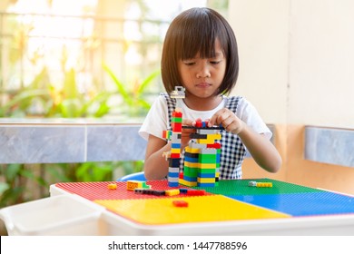 Asian Girl Kid Play Lego Or Toy, Asian Girls Relax With Playing Blocks, Asian Girls Enjoy Playing Toys.