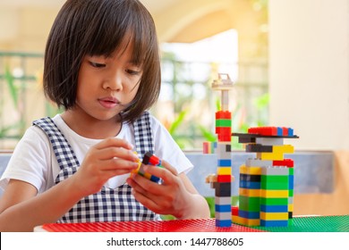 Asian Girl Kid Play Lego Or Toy, Asian Girls Relax With Playing Blocks, Asian Girls Enjoy Playing Toys.