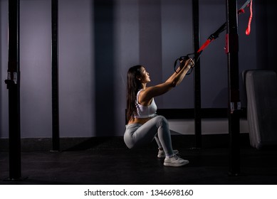 Asian Girl Learning Hard Workout.  Asian Woman Training With Trx Straps In The Gym