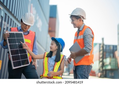 Asian Girl Learning The Technology Engineering Of Renewable Solar Cell . Engineers Meeting Checking And Inspecting. Concept Of Renewable Energy Working. Specialists Testing Photovoltaic Cells Module.