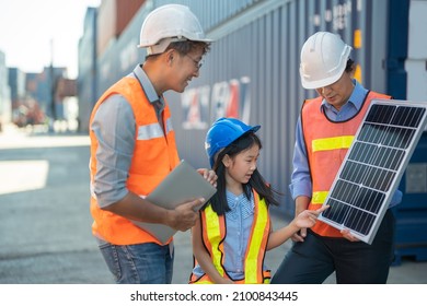 Asian Girl Learning The Technology Engineering Of Renewable Solar Cell . Engineers Meeting Checking And Inspecting. Concept Of Renewable Energy Working. Specialists Testing Photovoltaic Cells Module.