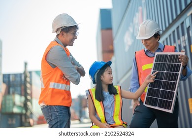 Asian Girl Learning The Technology Engineering Of Renewable Solar Cell . Engineers Meeting Checking And Inspecting. Concept Of Renewable Energy Working. Specialists Testing Photovoltaic Cells Module.