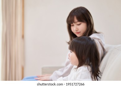 Asian Girl And Mom Watching Tv