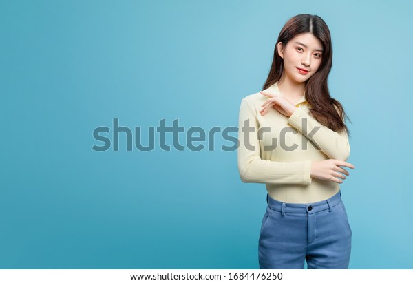 Asian Girl On Blue Background Stock Photo 1684476250 