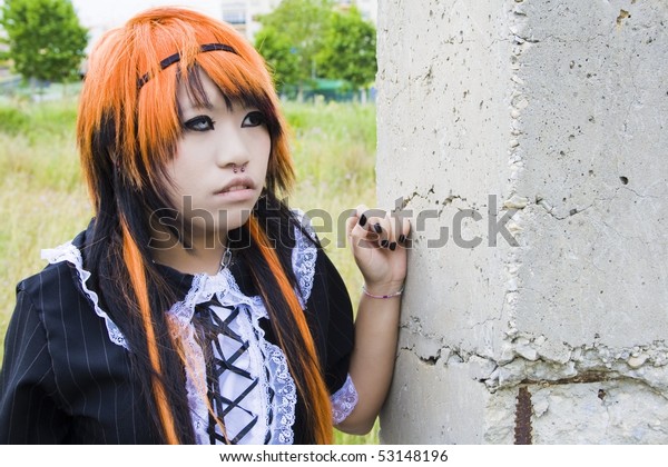Asian Girl Orange Hair Leaning On Royalty Free Stock Image