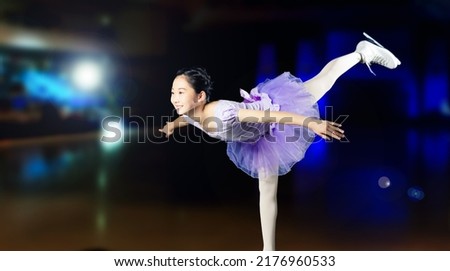 Asian girl performing figure skate. Figure skater.