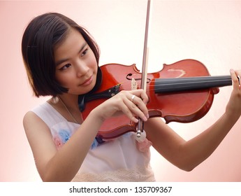 An Asian Girl Playing Violin