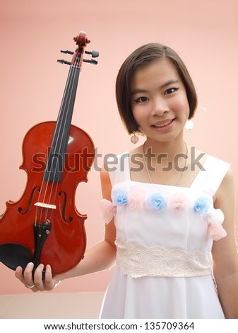 An Asian girl playing violin
