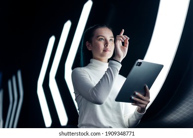 Asian girl pressing on digital screen futuristic technology - Powered by Shutterstock