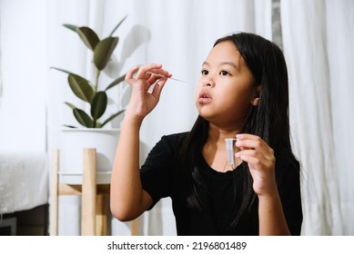 Asian Girl Preteen Girl Getting Swab Test At Home, Covid Quick Rapid Self Test, Kid Antigen Test