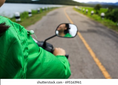 Asian Girl Riding A Motorcycle