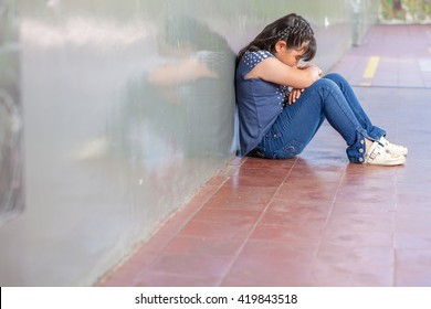 Asian Girl Sad At School. Isolation And Bullying Concept.